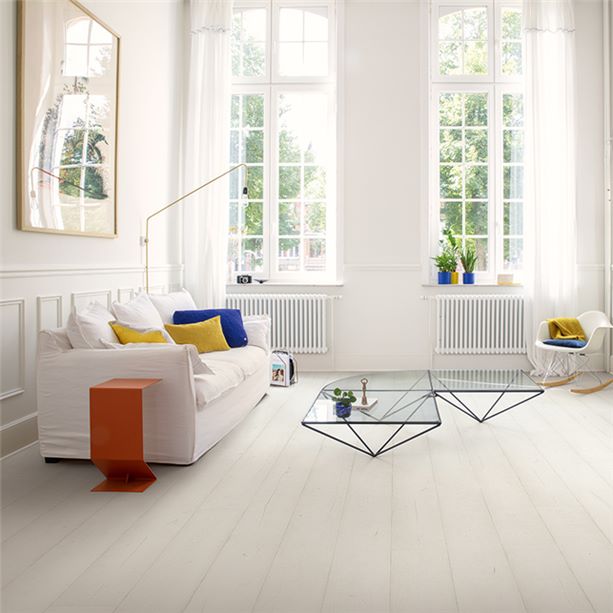 White vertical laminate flooring boards in the living room